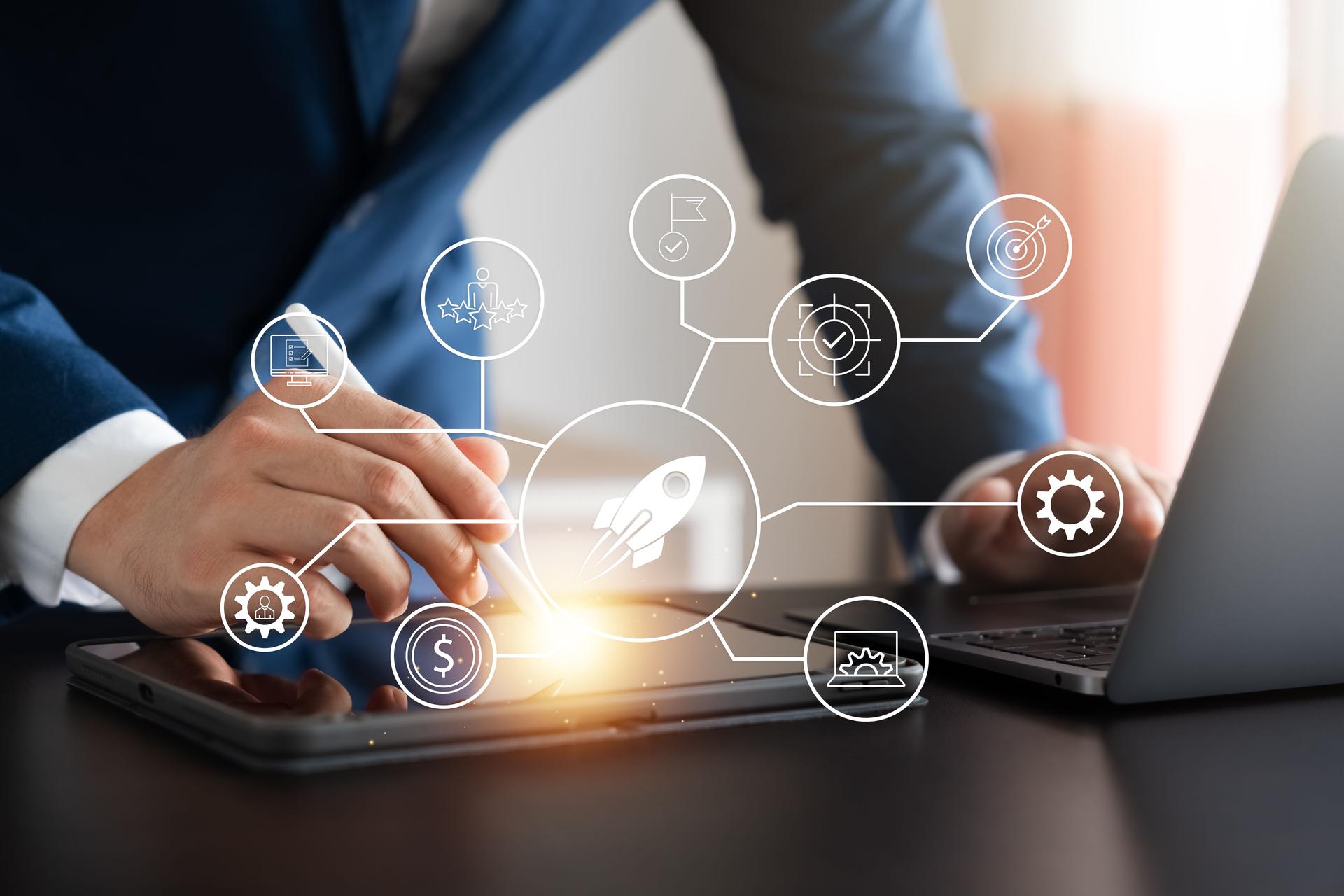 The concept of a successful startup business, a businessman touching a tablet screen, business icons and quick success, network connection on a modern global interface.